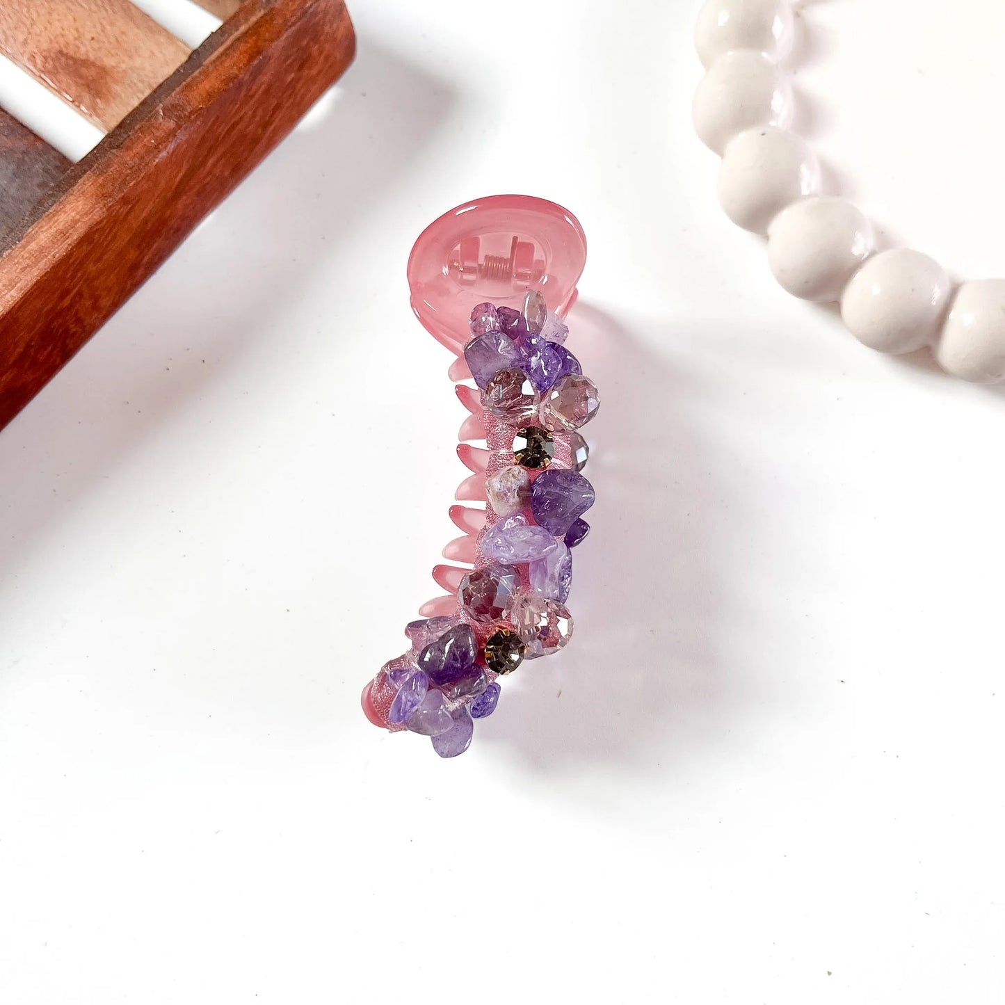 Purple-to-blush pink ombré glam chunk banana clip with oversized faceted gemstones in gradient tones.