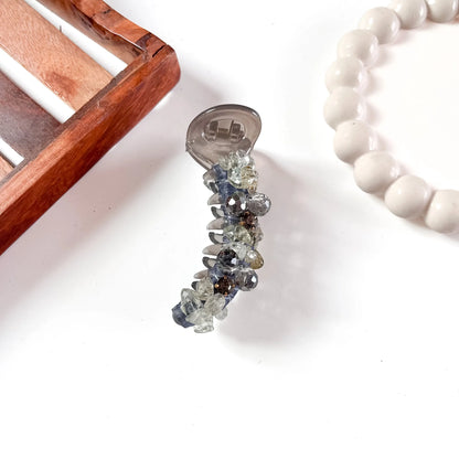 Smoky gray glam chunk banana clip with chunky faceted gemstone embellishments in mixed sizes creating textured sparkle.
