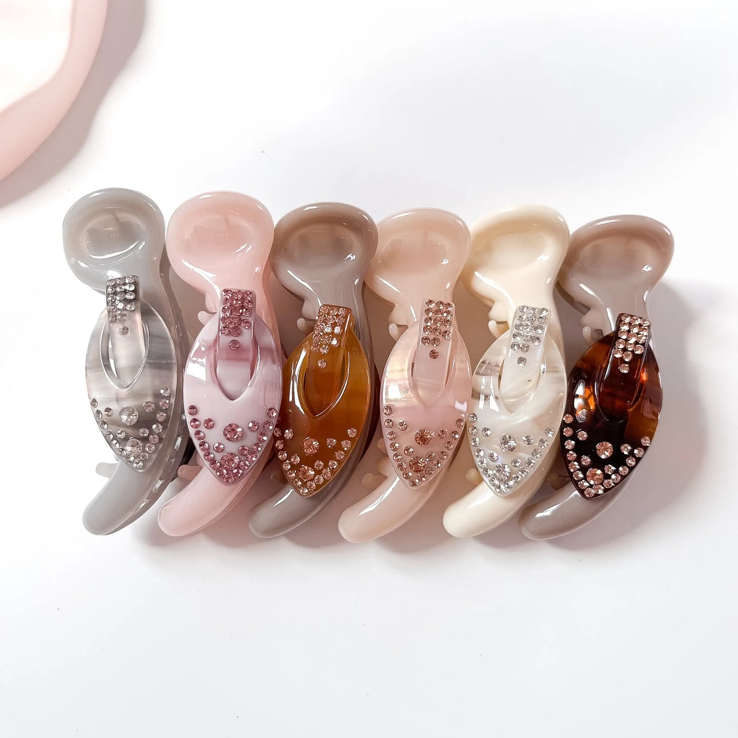 Gloss gem banana clips in grey, brown, ivory and blush peach with rhinestone detail