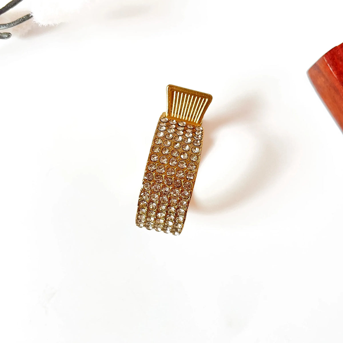 Gold rhinestone pony cuff with champagne stones and comb-top mechanism