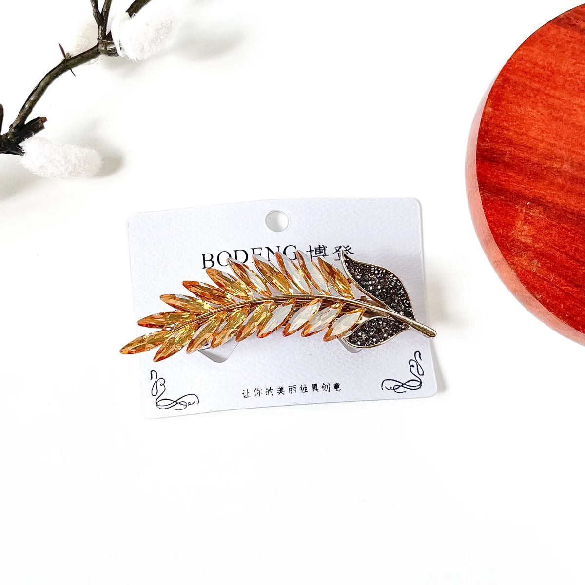Champagne gold crystal feather hair clip with rhinestone leaf, a jeweled barrette for weddings