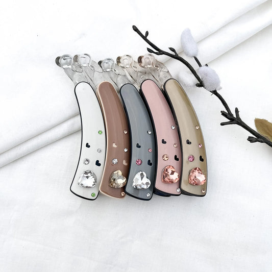 Color swatch: all 5 heart gem lock banana clip shades displayed in a row