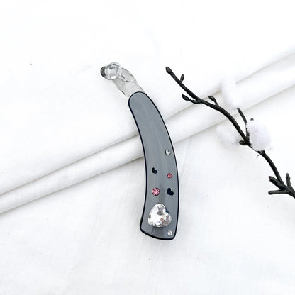 Grey/slate lock banana clip with faceted heart gem and scattered rhinestone hearts, 8cm