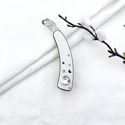 White acrylic lock banana clip with faceted heart gem and rhinestone heart details, 8cm