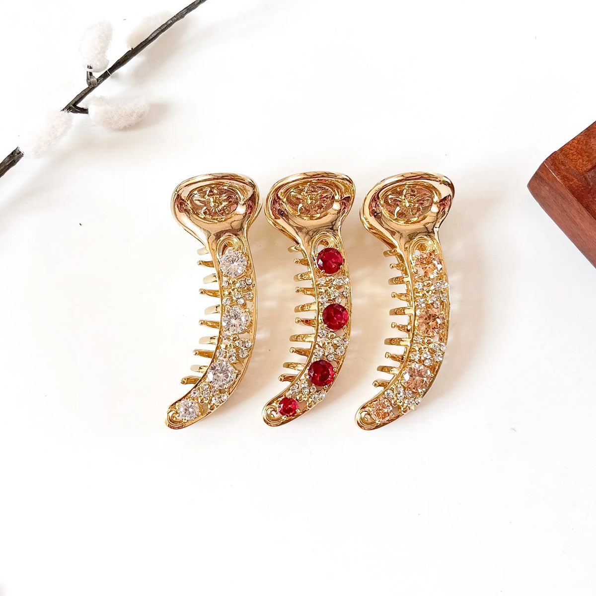 Heirloom Gold 8 cm anti-tarnish metal banana clips in crystal clear, ruby red and champagne peach stones