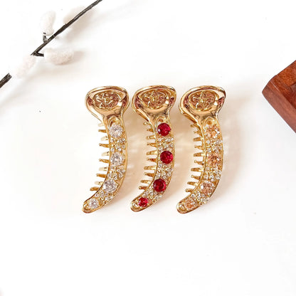 Heirloom Gold 8 cm anti-tarnish metal banana clips in crystal clear, ruby red and champagne peach stones