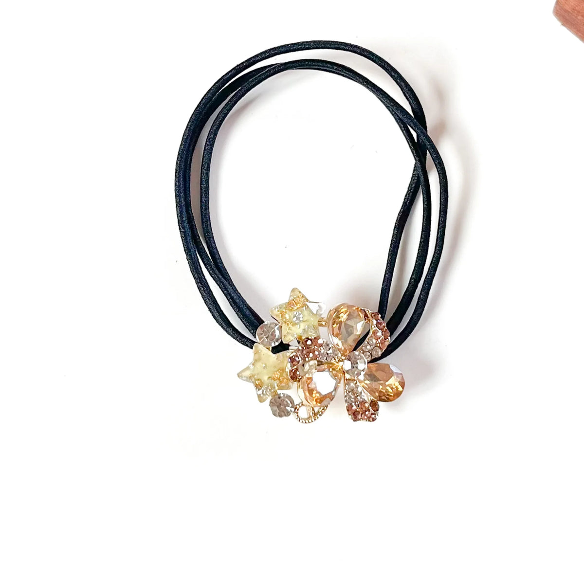 Honey gold fancy hair rubber band with champagne crystals and yellow glitter stars, dressy ponytail holder