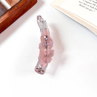 Blush pink iridescent lock banana clip with flower and crystal detail