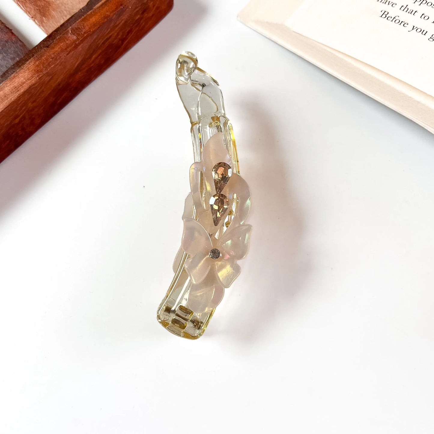 Champagne gold iridescent lock banana clip with flower and crystal detail