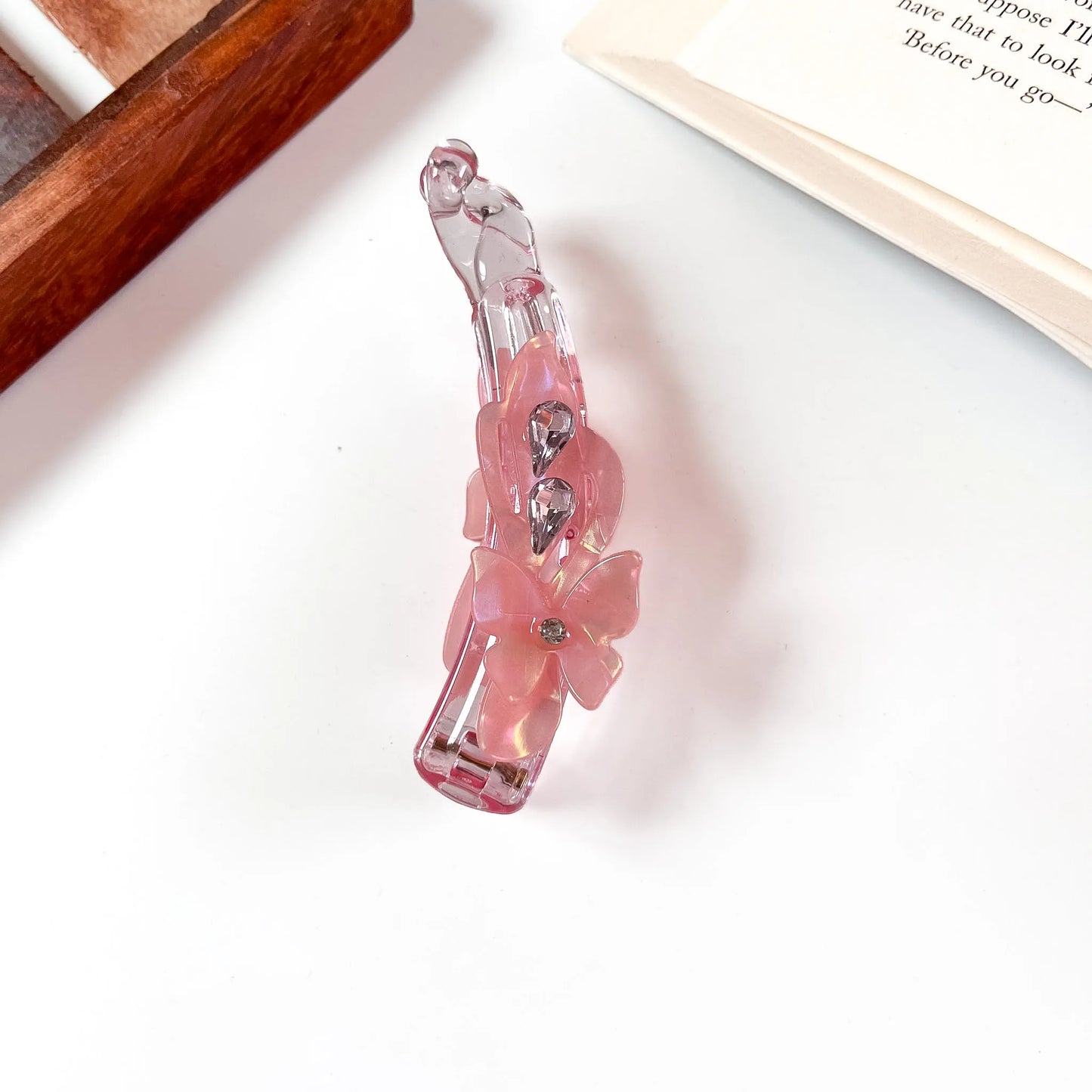 Rose pink iridescent lock banana clip with flower and crystal detail