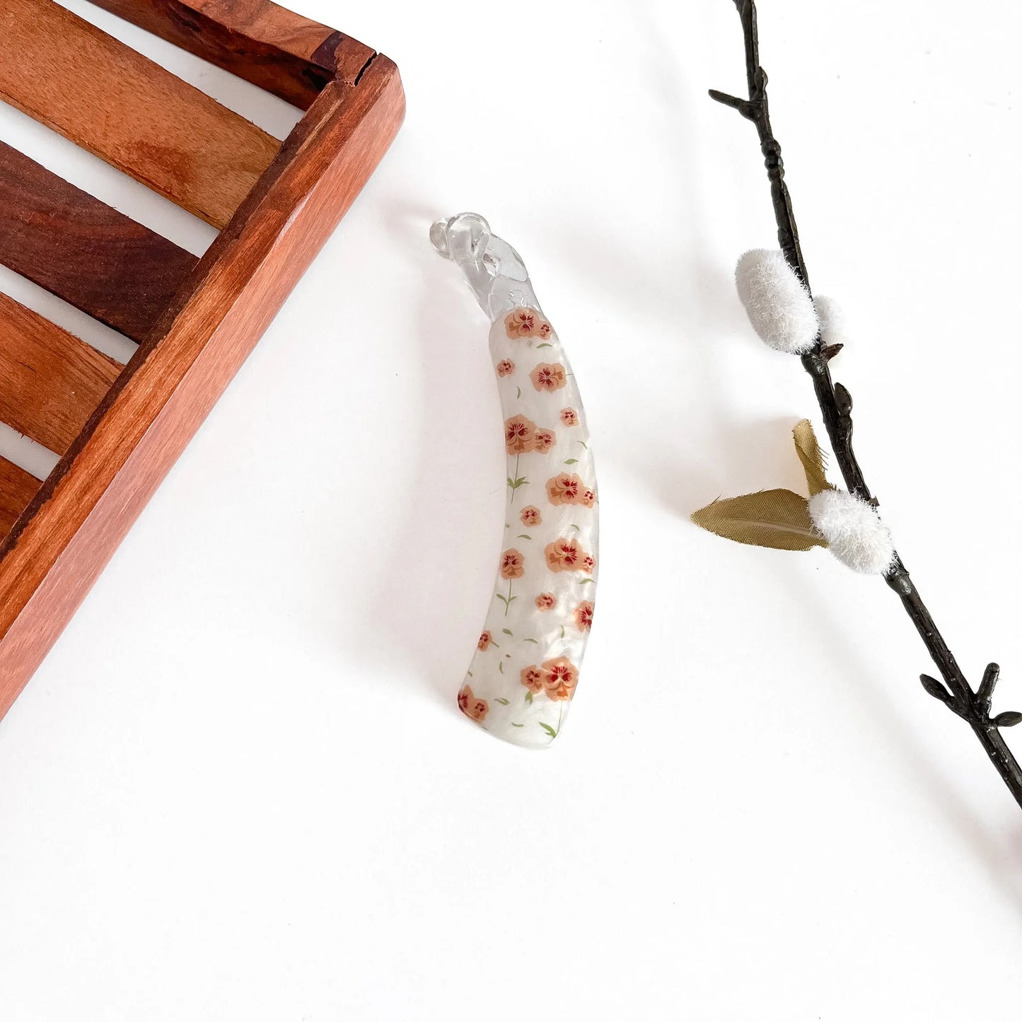 Orange/peach floral print lock banana clip with dense flower pattern, 10cm