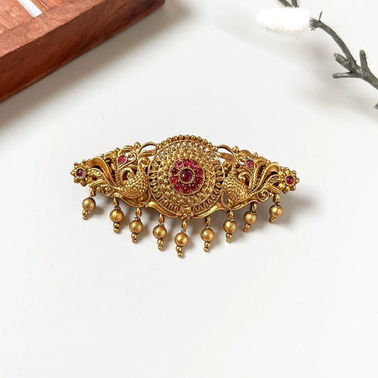 Matte antique gold centre clip with ruby red kemp medallion and gold bead drops