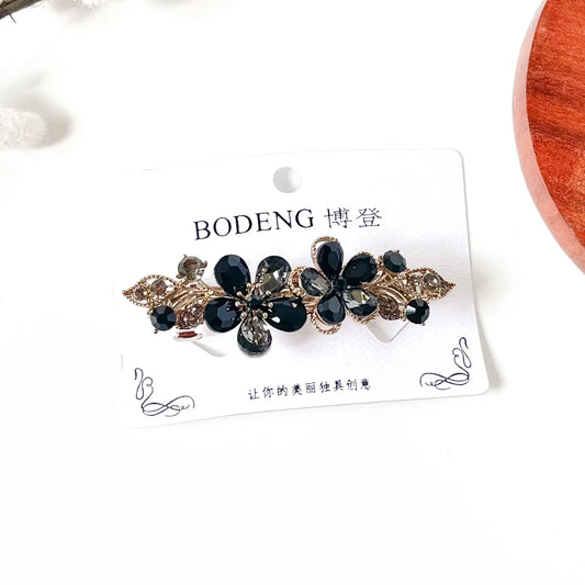 Noir black crystal flower hair clip with antique gold leaves, an elegant rhinestone barrette for buns