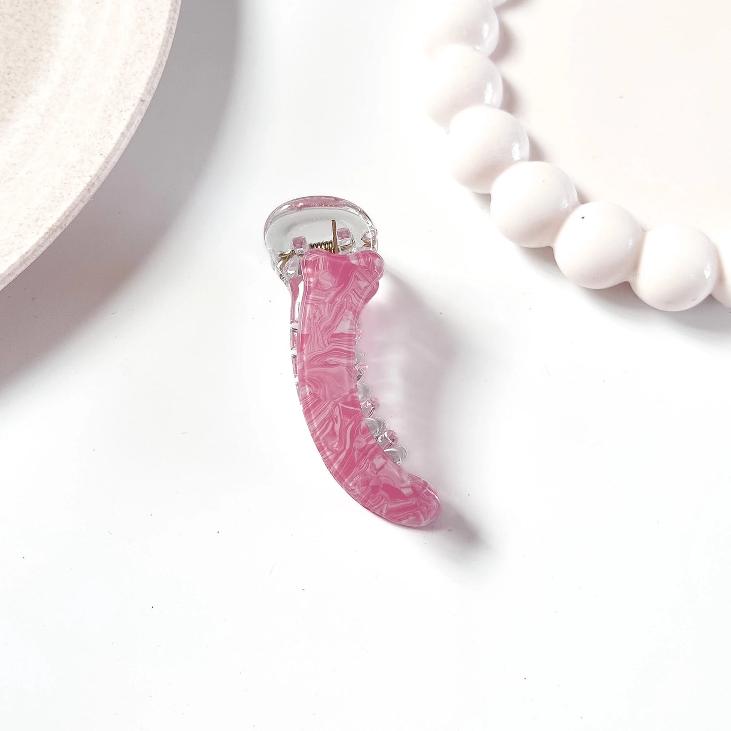Pink marble acetate banana clip with clear acrylic teeth
