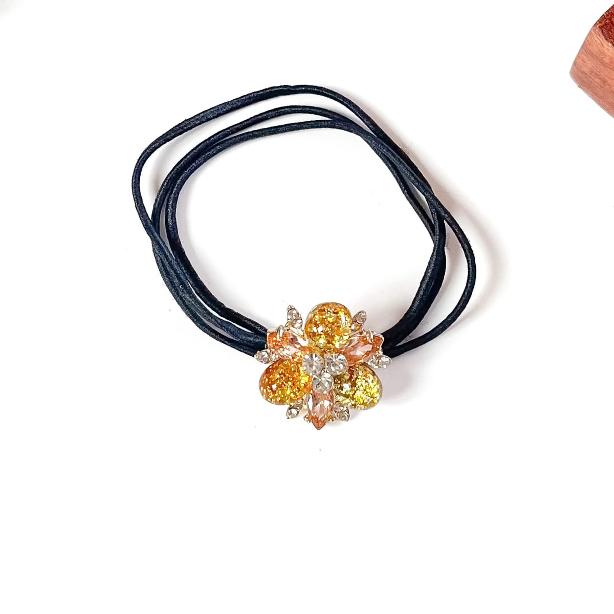 Marigold yellow fancy hair elastic with gold glitter stones and peach crystals on black elastic