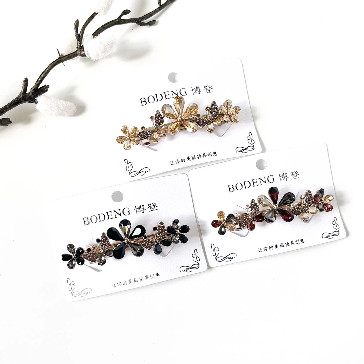 Meadow Bloom crystal flower and butterfly barrettes in champagne gold, noir black and harvest multicolour