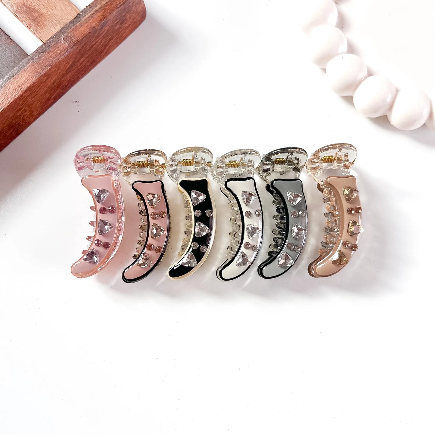Color swatch: all 6 minimal gem banana clip shades displayed in a row