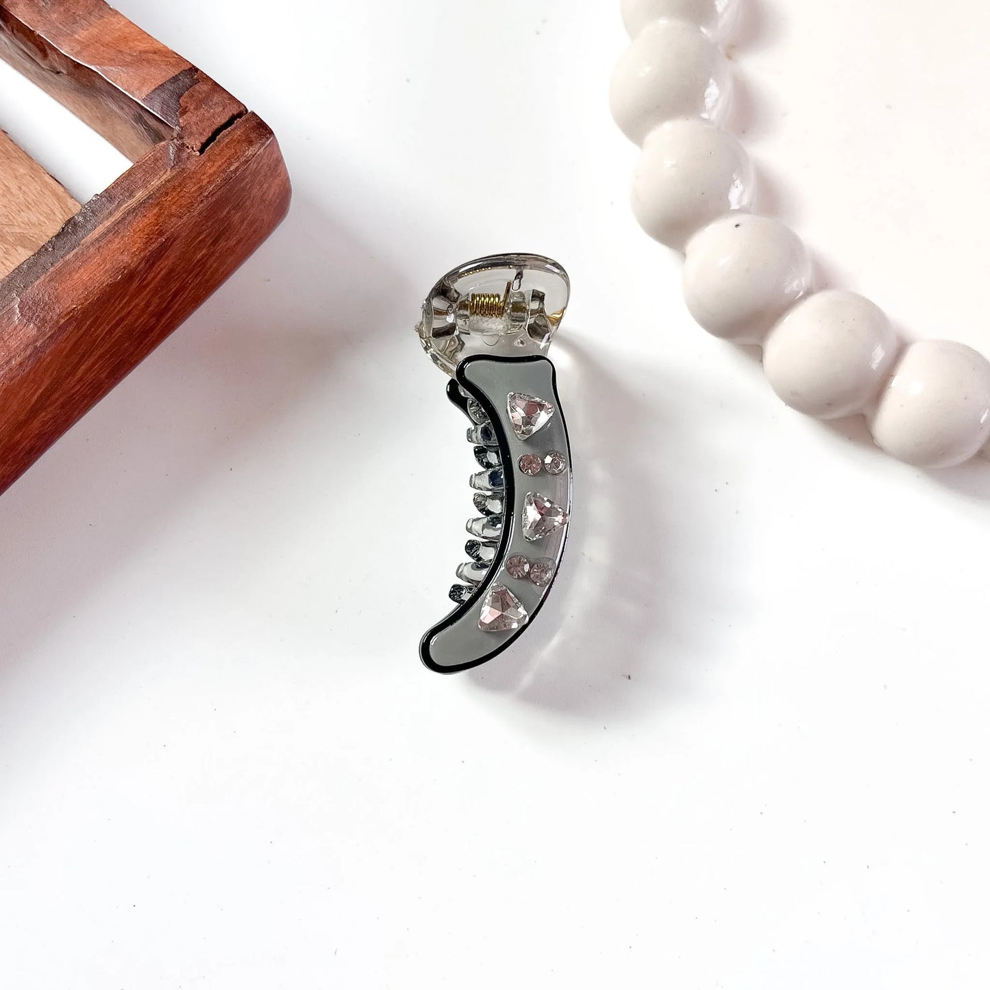 Grey acrylic minimal banana clip with faceted heart gem and rhinestone accents, 5cm