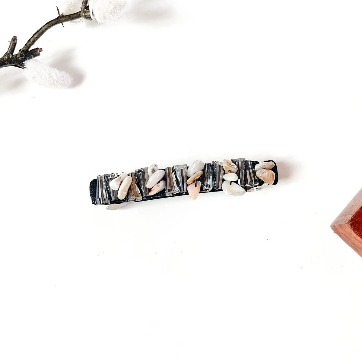 Noir black velvet hair clip with smoky grey baguette crystals and ivory shell chips