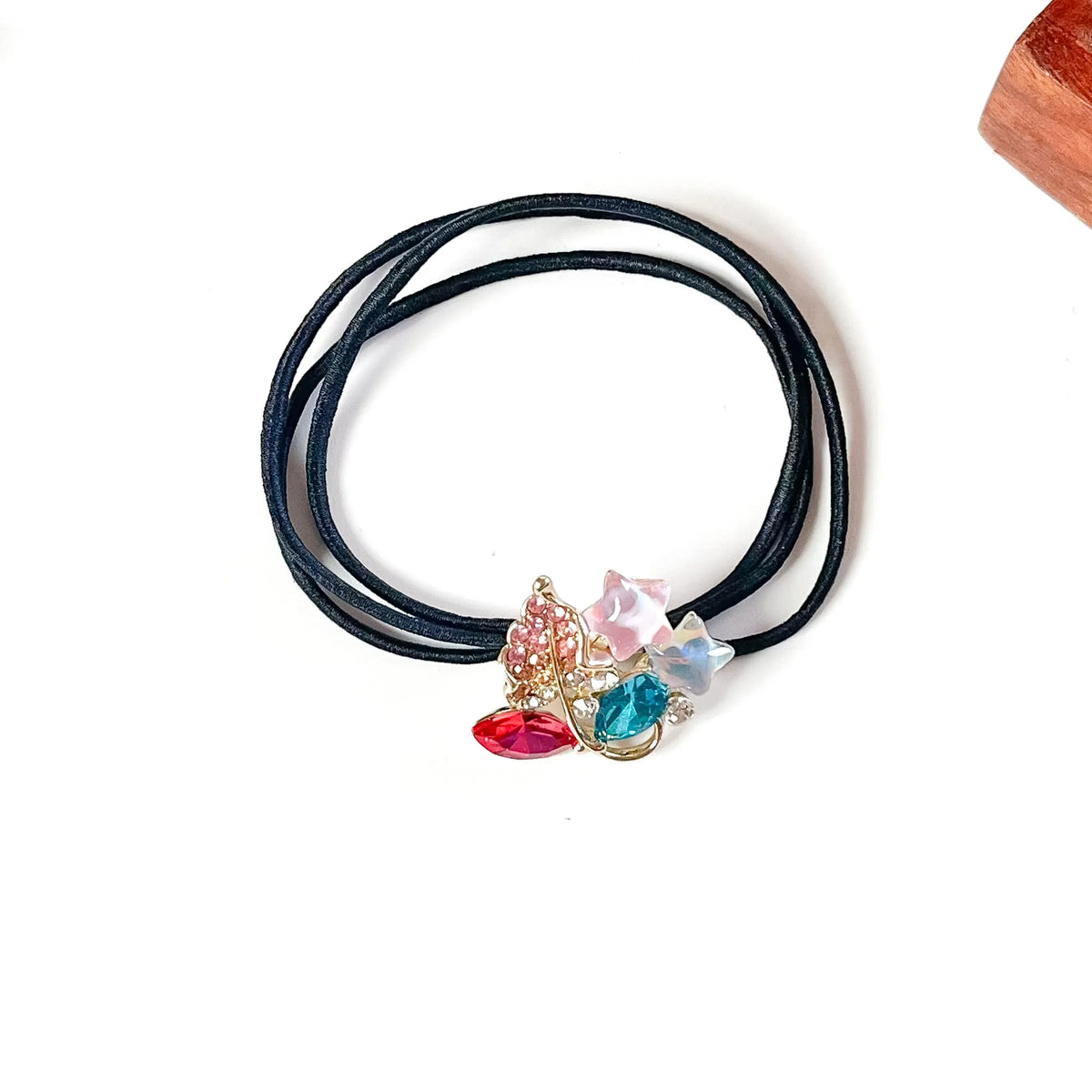 Mosaic multicolour fancy hair tie with pink and teal crystals, rhinestone leaf and pastel star charms