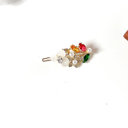 Navaratna multicolour stone hair clip with red, orange and green stones and pearls