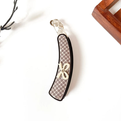 Black lock banana clip with brown plaid interior and beige flower accent, large 10cm size for all hair types