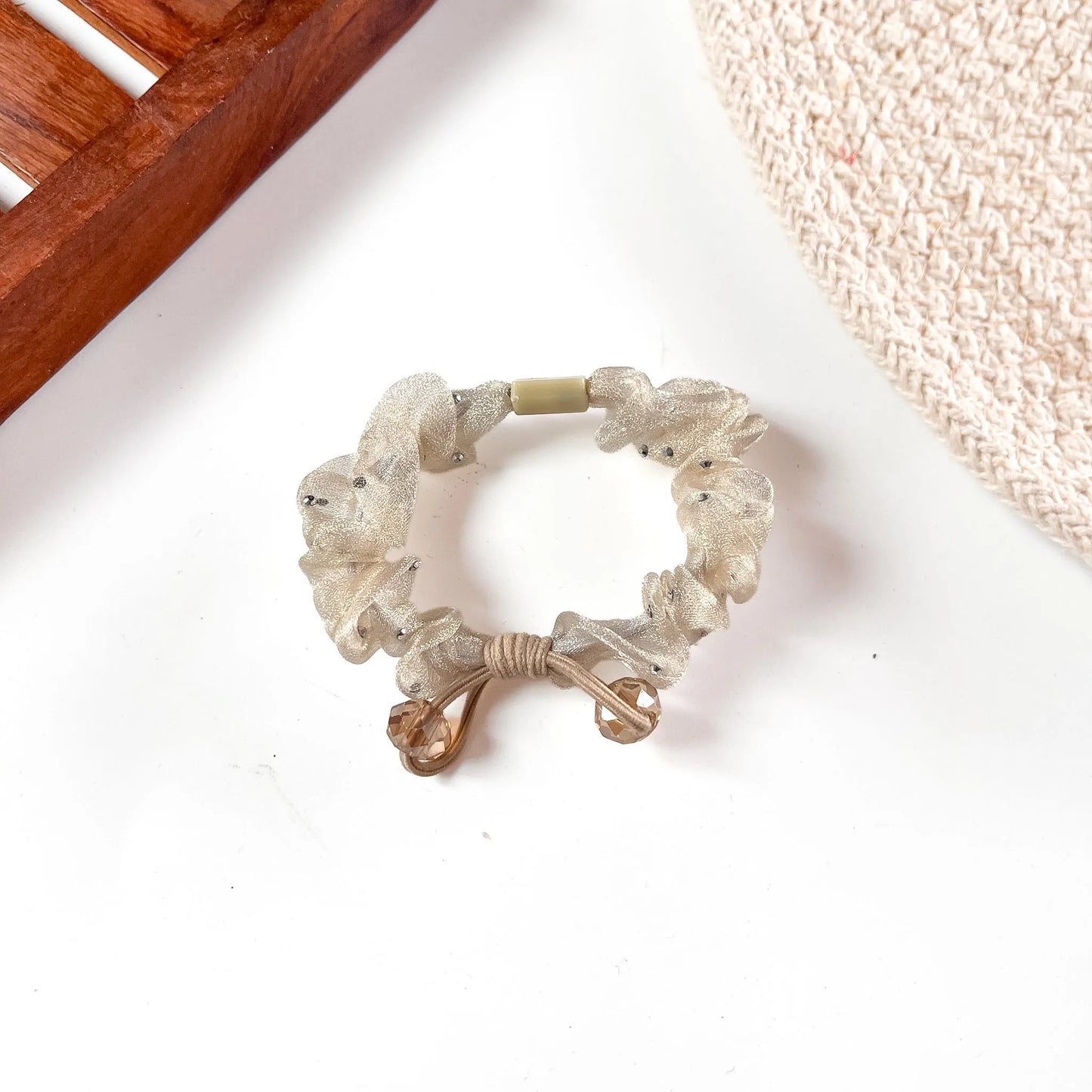 Cream ivory organza scrunchie with faceted glass beads and bronze-tone metal trim.