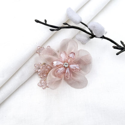 Cream ornate alligator clip with layered mesh petals, crystal flower and faceted details,