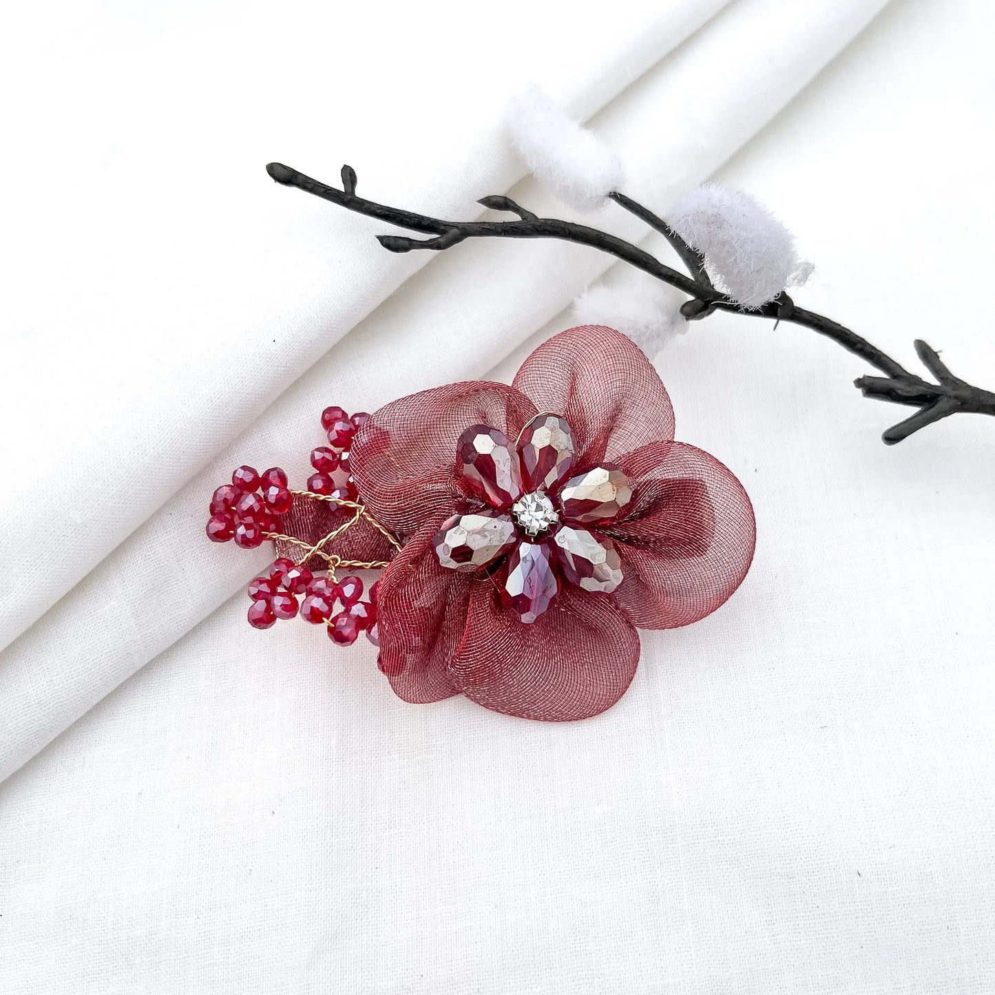Deep red/maroon ornate alligator clip with mesh petals, faceted crystal flower and gems,