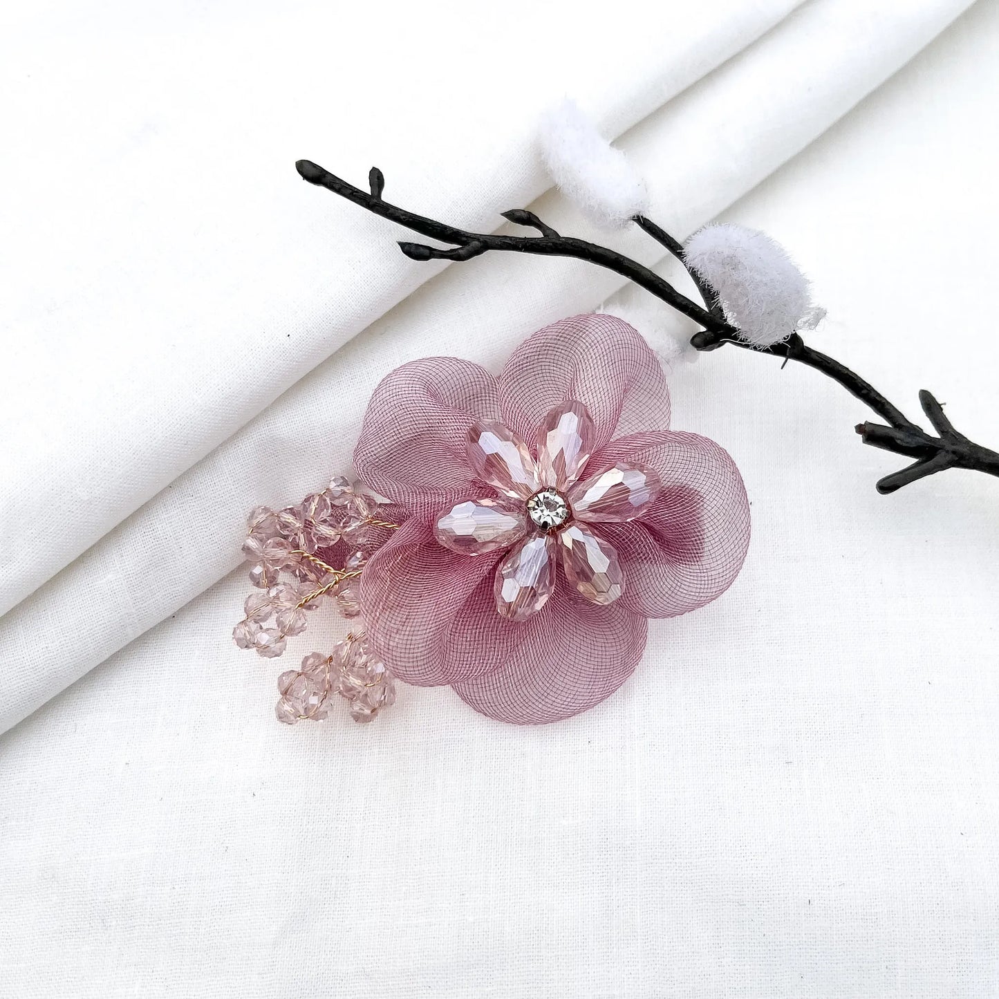 Pink ornate alligator clip with layered mesh petals, crystal flower and decorative berry details,