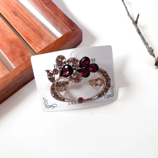 Maroon Red Wine ornate crystal barrette with rhinestone oval frame and leaf scrollwork
