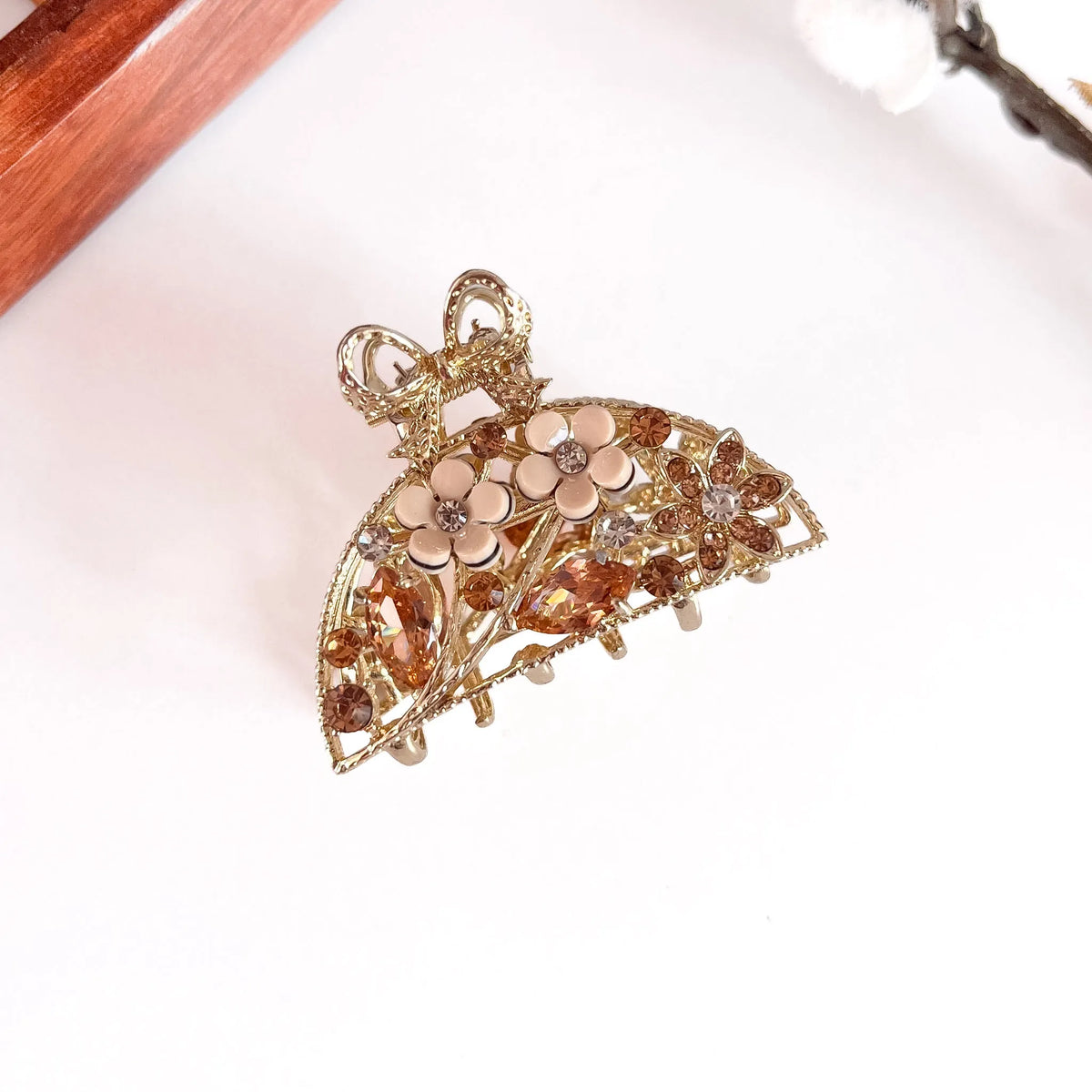 Amber orange ornate pearl bow metal clip with pearl flower detail, medium-thick gemstone clip