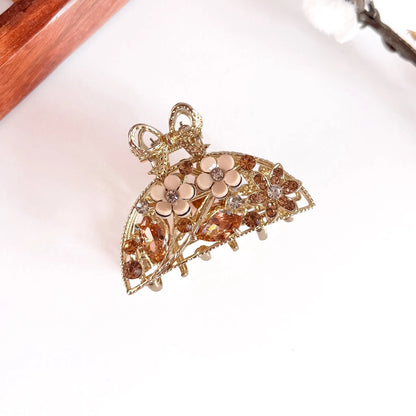 Amber orange ornate pearl bow metal clip with pearl flower detail, medium-thick gemstone clip