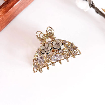 White clear crystal ornate pearl bow clip with ornate filigree metal base, medium-thick metal barrette