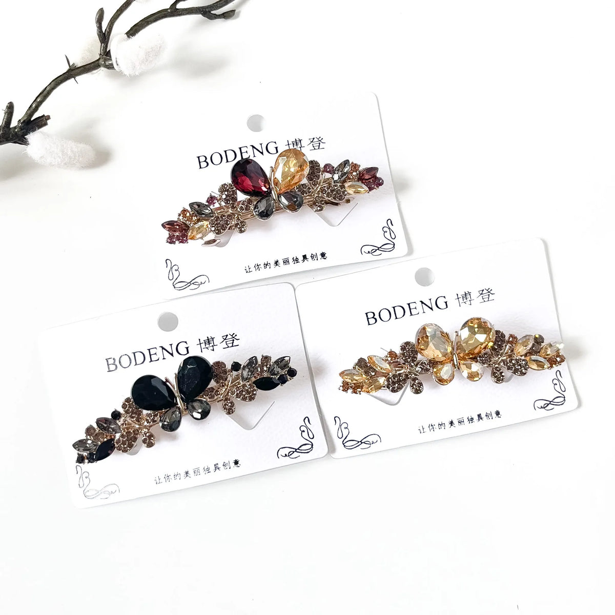 Pari butterfly hair barrettes with stones in champagne gold, noir black and harvest multicolour
