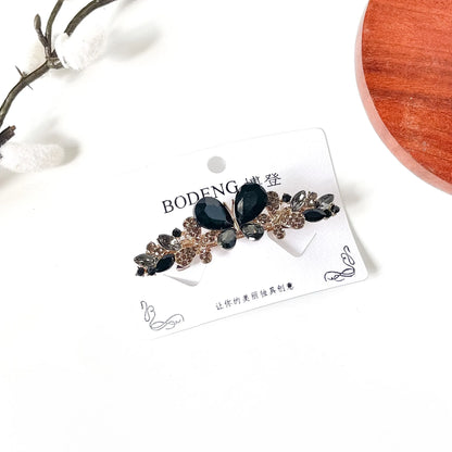 Noir black butterfly barrette with smoky grey rhinestones, an elegant French hair clip for buns