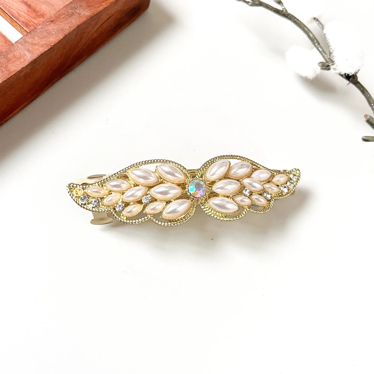Gold pearl cabochon wing barrette with white ovals and rainbow centre accent, decorative hair clip