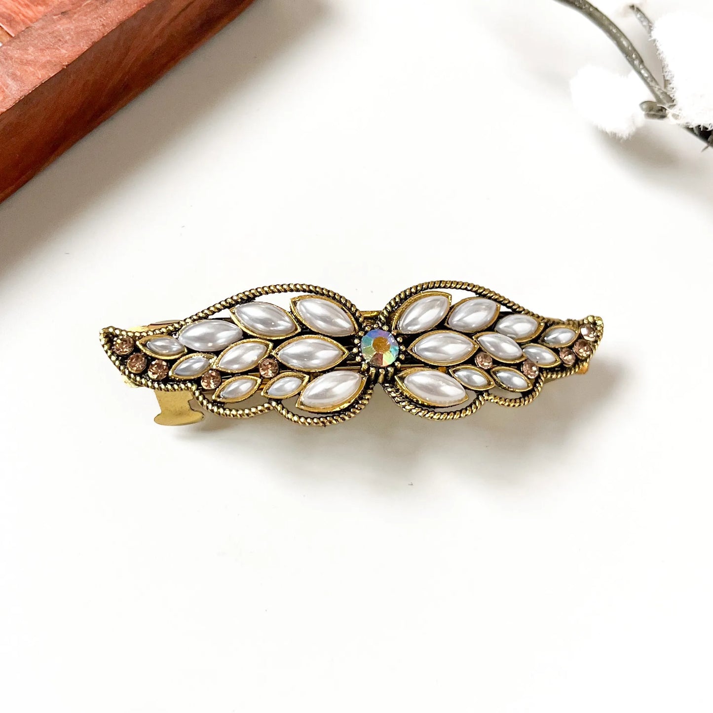 Rose gold champagne cabochon wing barrette with honey-toned faceted stones and opal centre
