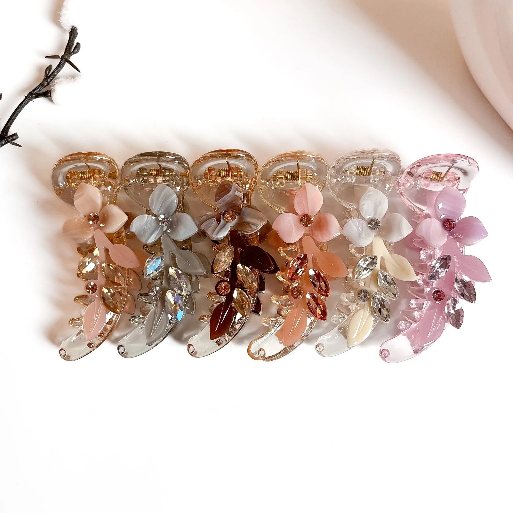 Pearl leaf banana clips in champagne, grey pearl, brown, peach, white and pink with marquise crystal sprigs