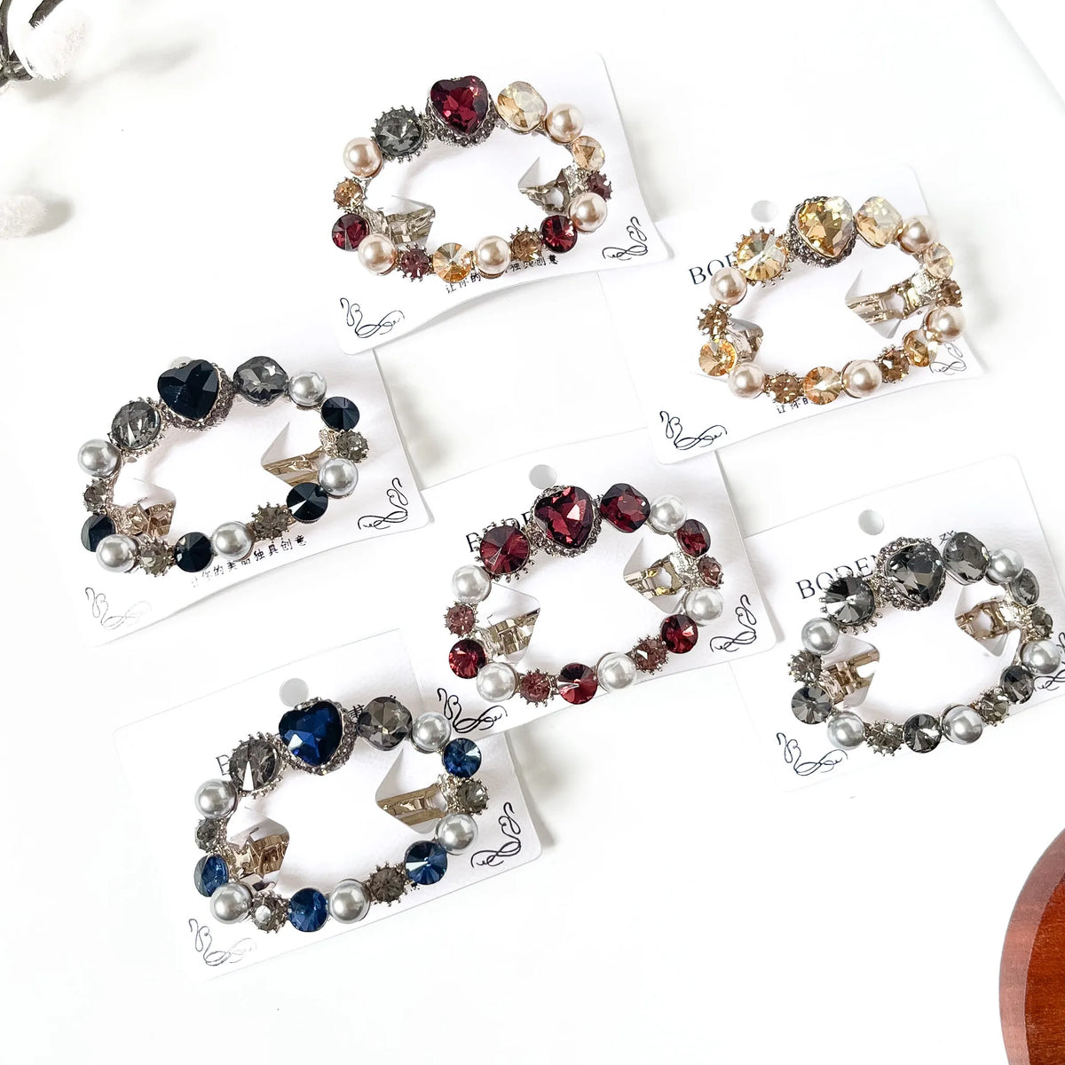 Pearl Promise pearl and crystal center clips in noir black, sapphire navy blue, merlot burgundy, champagne gold, harvest multicolour and slate grey