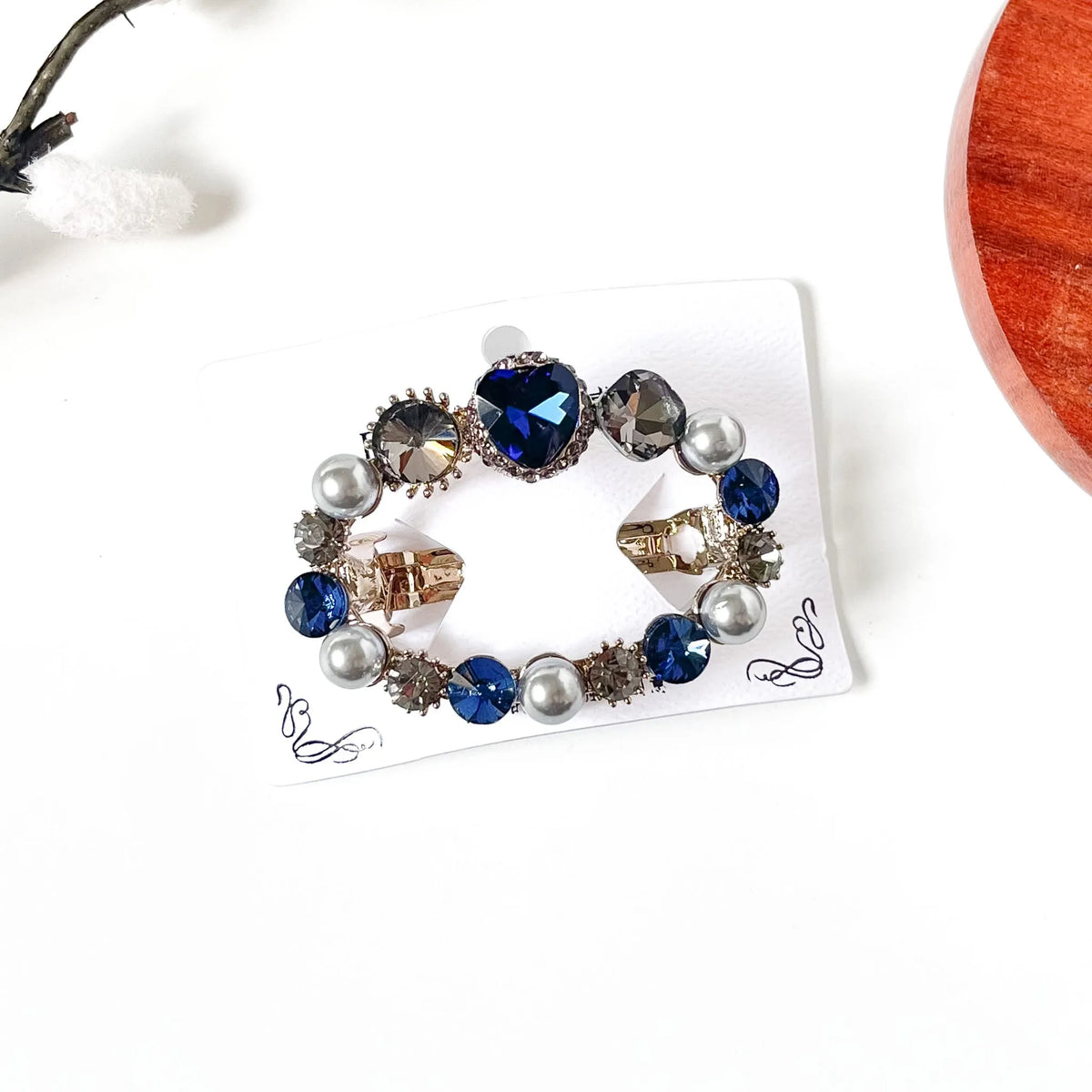 Sapphire navy blue heart stone center clip with pearls, a fancy pearl hair barrette