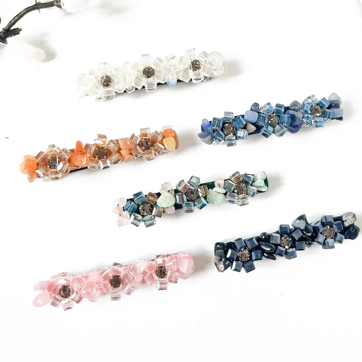 Pebble Bloom crystal stone barrettes in noir black, apricot peach orange, jade mint green, blush pink, sapphire blue and frost clear white