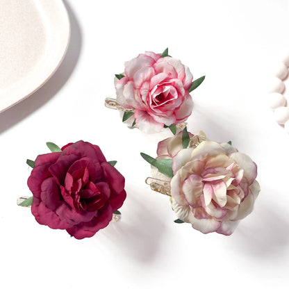 Peony bloom flower hair clip in burgundy pink and cream with green leaf accents