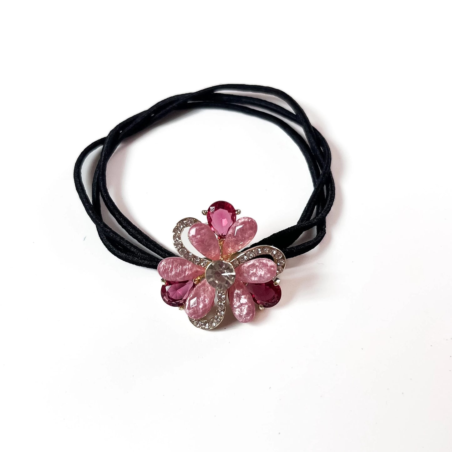 Pink petal bloom flower crystal hair tie with rhinestone frame on black elastic band