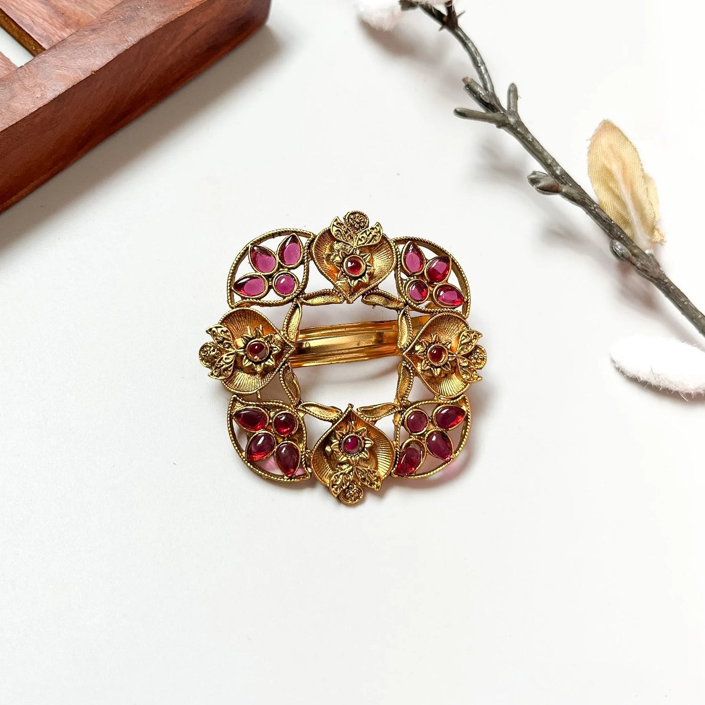 Ruby red petalled gemstone shield barrette with geometric four-petal design, antique gold 4cm clip