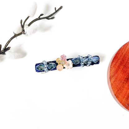 Sapphire navy blue velvet hair clip with light blue crystals and a shell flower, a cute blue hair barrette