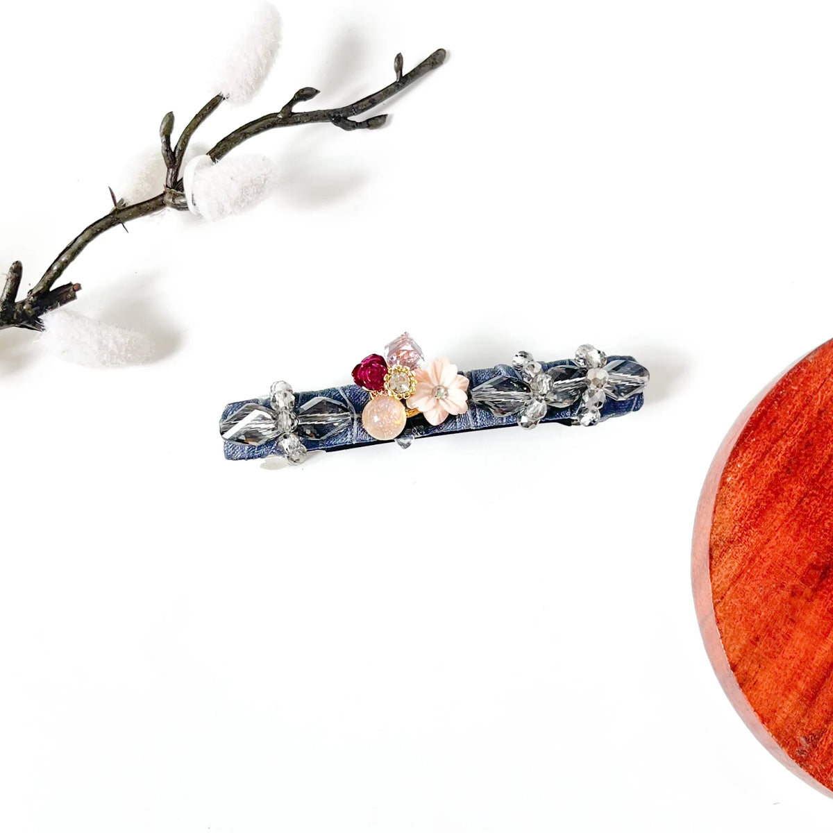 Slate grey crystal hair clip on grey velvet with a pink shell flower, a classy everyday barrette