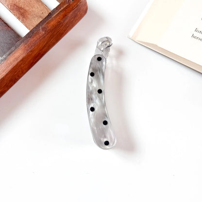 Grey marbled snap clip with black polka dots