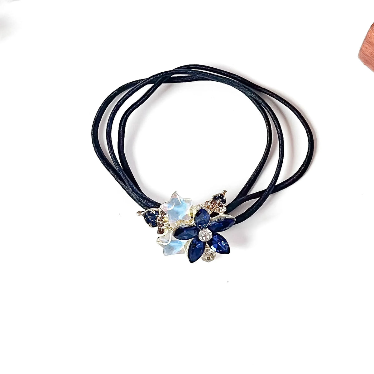 Royal blue flower hair tie with navy crystal petals and white star charms, rhinestone hair rubber band