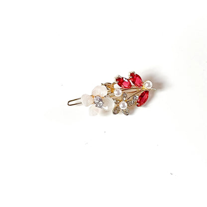 Ruby red stone hair clip with pearls and white flower in gold tone
